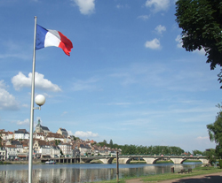 joigny with french flag in foreground